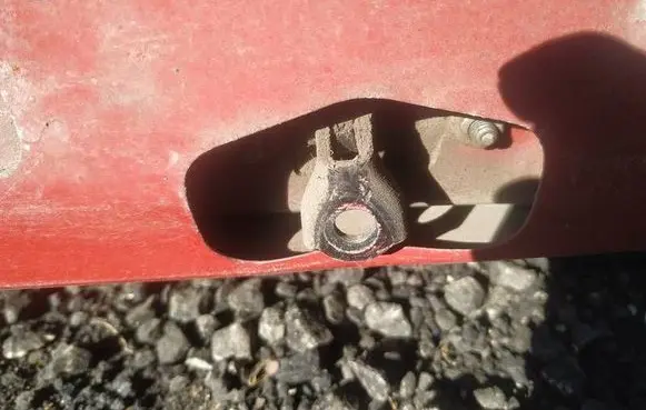 Front door check strap stopper