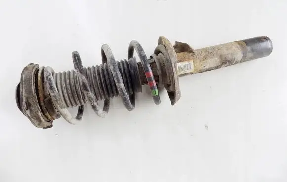 Volkswagen Caddy Front shock absorber with coil spring
