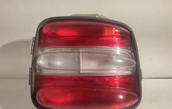 Tail light bulb cover holder