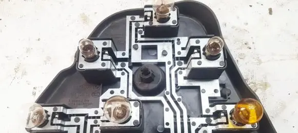Tail light bulb cover holder