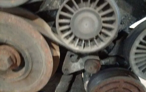 Opel Zafira A Generator/alternator belt tensioner
