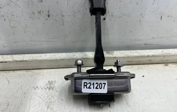 Front door check strap stopper