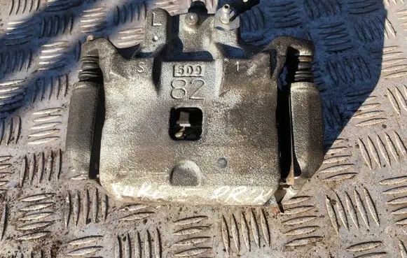 Nissan Juke I F15 Front brake caliper