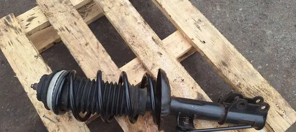 Opel Corsa D Front shock absorber with coil spring 