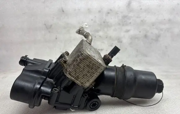 Volkswagen PASSAT B6 Oil filter mounting bracket 06D117021C 47031