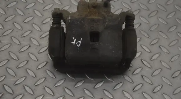 Nissan Juke I F15 Front brake caliper