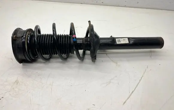 Volkswagen Golf VII Front shock absorber with coil spring 5Q0413023FH 5Q04GH