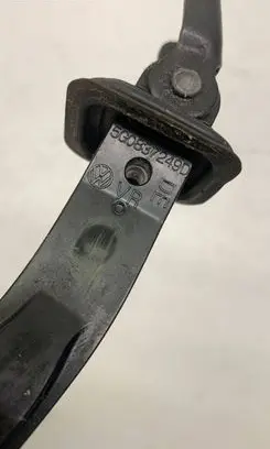 Front door check strap stopper
