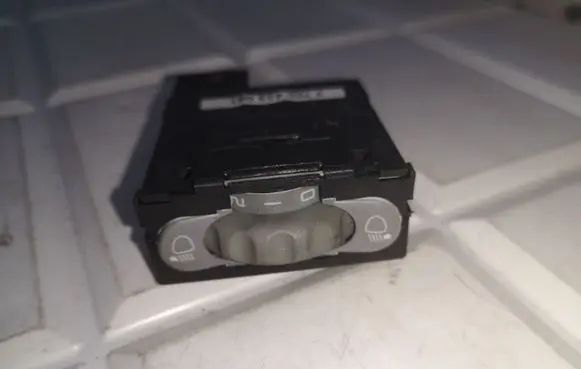 Headlight level height control switch