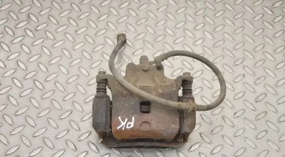 Nissan Juke I F15 Front brake caliper