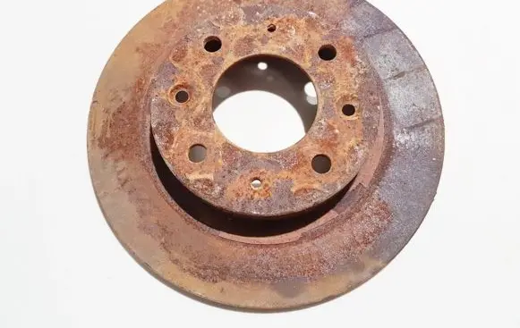 KIA Carens I Rear brake disc neventiliuojamas