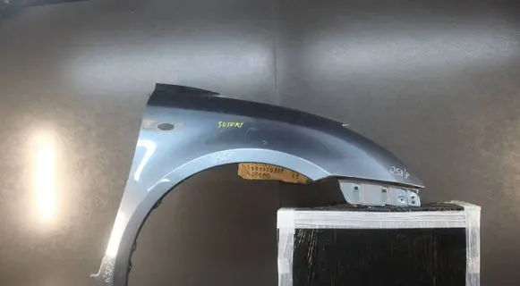 Suzuki Swift I Fender mounting bracket 