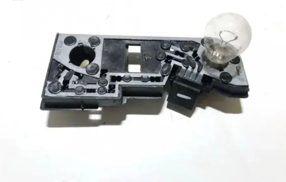 Tail light bulb cover holder
