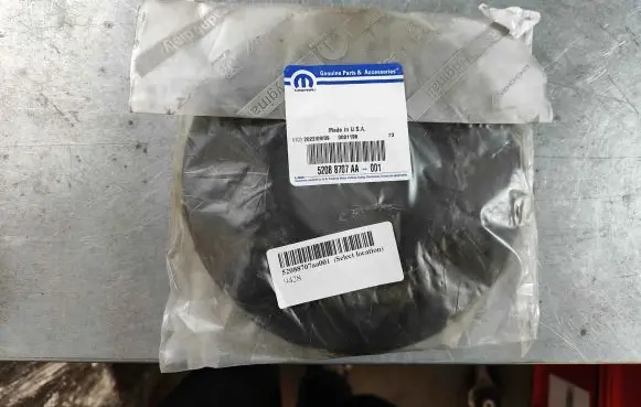 Chrysler Liberty II Coil spring/strut mount 52088707aa001