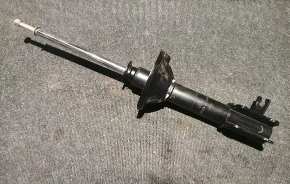 Mazda 323 Front shock absorber/damper B44528700