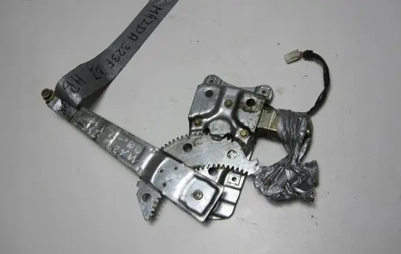 Mazda 323 F Rear door window regulator with motor