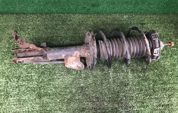 Front shock absorber with coil spring