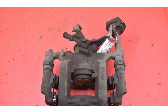 Opel Astra J Rear brake caliper 