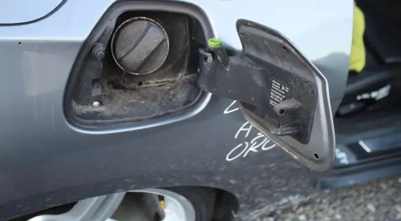 Fuel tank cap lock