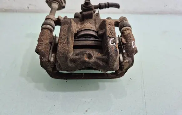 Opel Astra J Rear brake caliper 