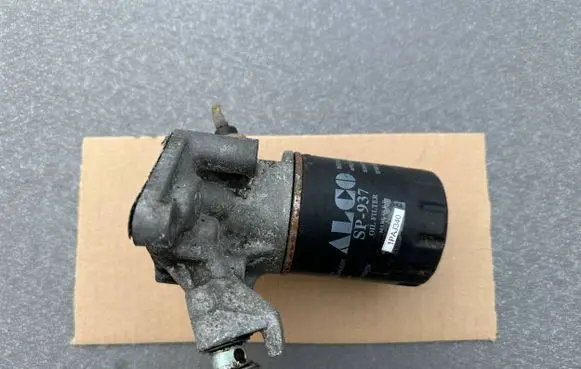 Mitsubishi Pajero Oil filter mounting bracket MD124957