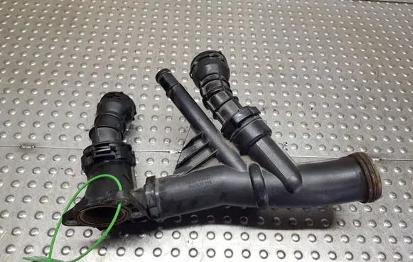 Volkswagen Golf VII Thermostat housing S27708302 04L121071E