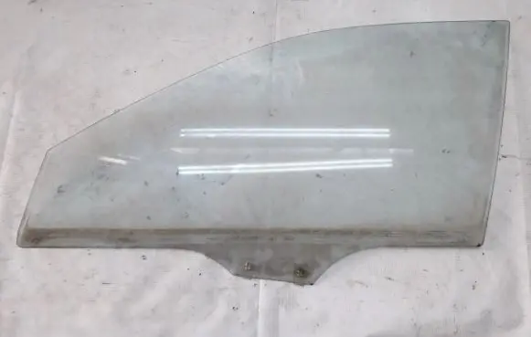 Mazda 323 Front door window glass four-door