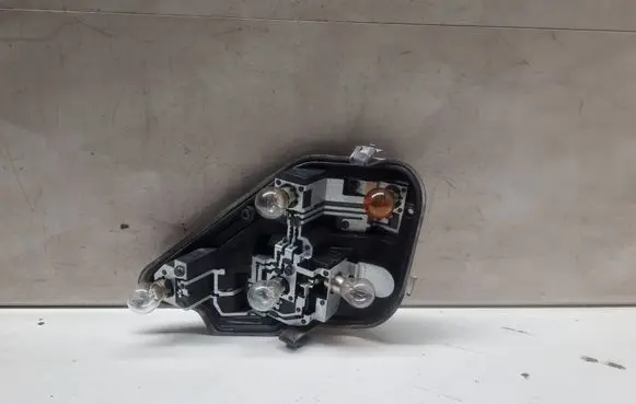 Tail light bulb cover holder