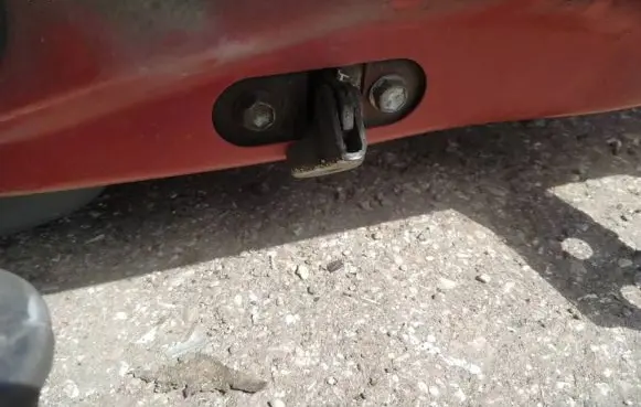 Front door check strap stopper