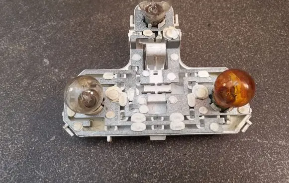 Volvo S80 Tail light bulb cover holder