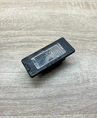 Volkswagen Touareg I Number plate light 5N0943021 1K9943021A