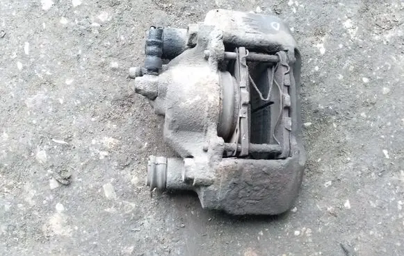 Mazda 323 F Front brake caliper