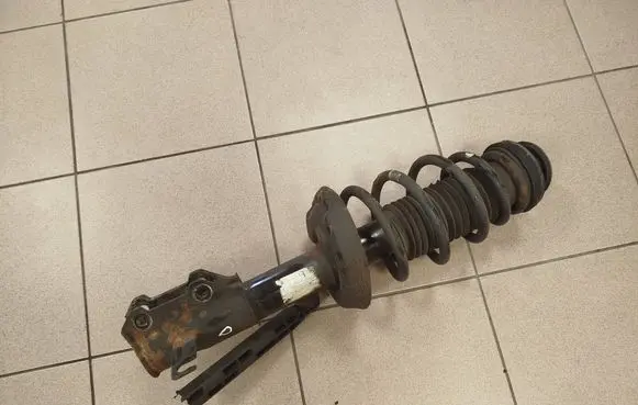 Opel Zafira C Front shock absorber with coil spring 13338924
