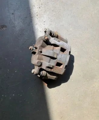 Subaru Outback (BT) Front brake caliper 