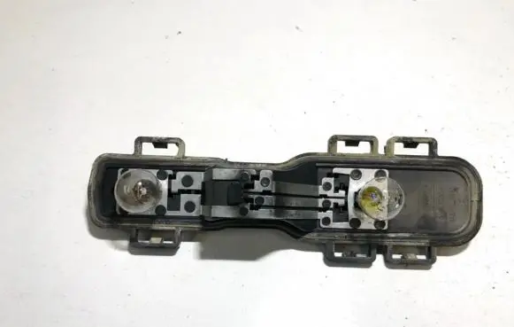 Nissan Primera Tail light bulb cover holder