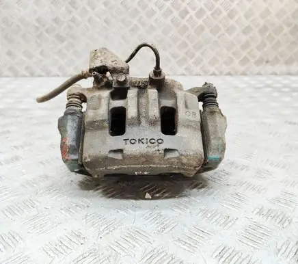 Mitsubishi L200 Front brake caliper MR977362