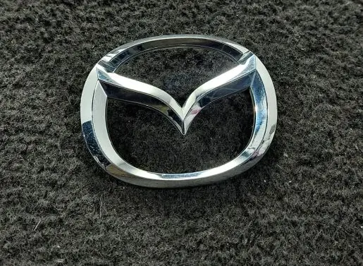 Mazda 323 F Manufacturers badge/model letters 