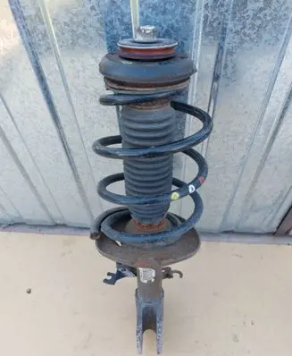 Front shock absorber with coil spring
