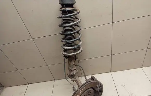 Volkswagen Golf III Front shock absorber with coil spring 1H0413031L