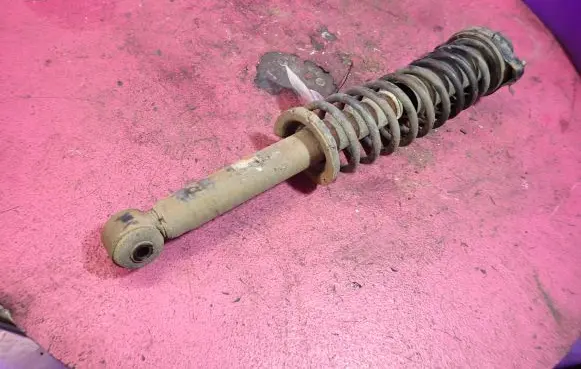 Mitsubishi Carisma Rear shock absorber with coil spring MR455351