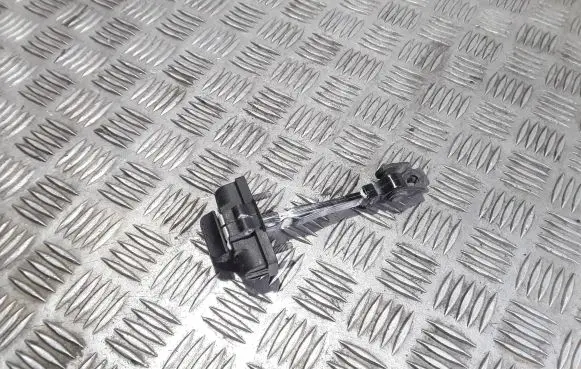 Front door check strap stopper