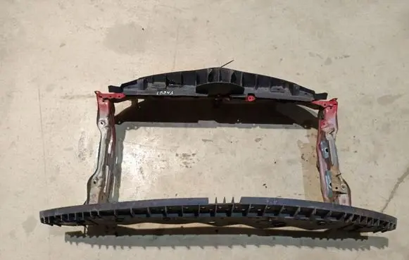 Radiator support slam panel