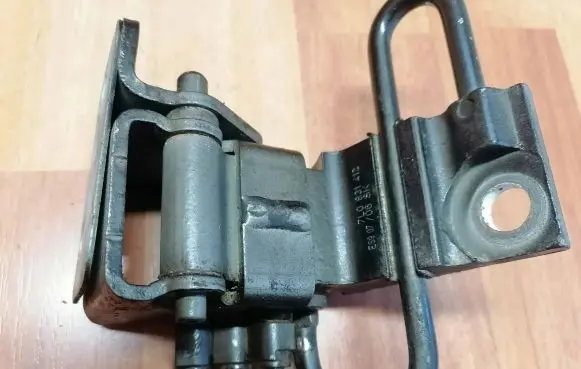 Front door lower hinge