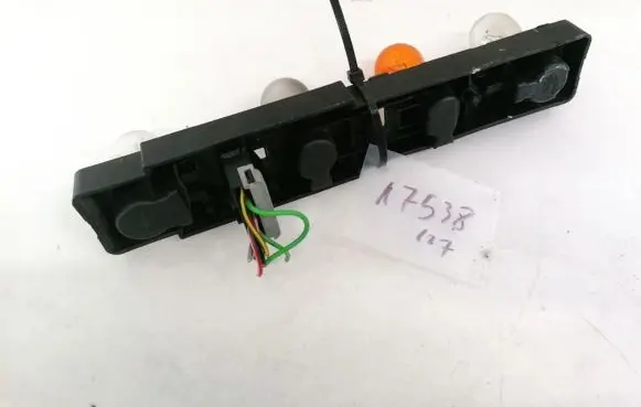 Tail light bulb cover holder