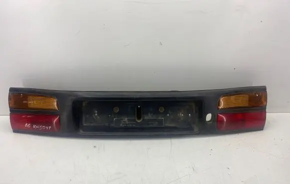 Renault Laguna I Trunk door license plate light bar 7711170346