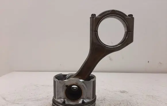Piston with connecting rod