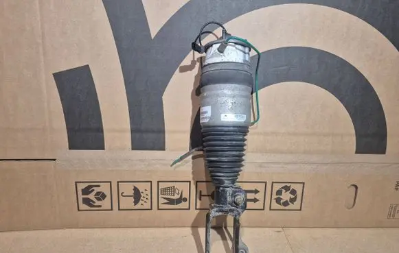 Volkswagen Touareg II Air suspension front shock absorber 7P6616040L