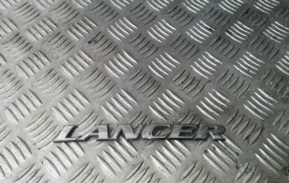 Mitsubishi Lancer Manufacturers badge/model letters 245075 245075XR