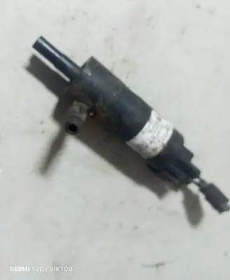Opel Zafira B Headlight washer pump 90508709