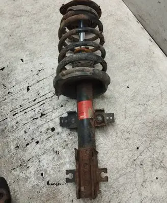 Front shock absorber with coil spring